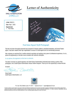 ASTRONAUT FRED HAISE  HAND-SIGNED AND INSCRIBED PHOTOGRAPH OF EARTH