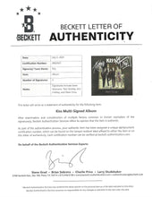KISS ' DRESSED TO KILL '  HAND-SIGNED ALBUM COVER AND VINYL SET-UP